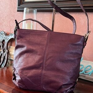 Coach Perforated Butter Soft Leather. Purple/Plum color w/ Silver-tone hardware.